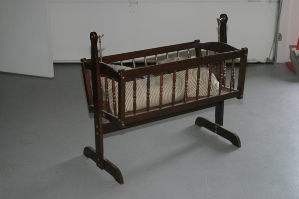 old wooden baby cradle