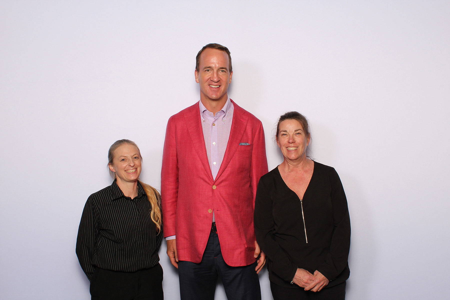 Peyton Manning posing for a photo at a VIP Meet and Greet in Toledo
