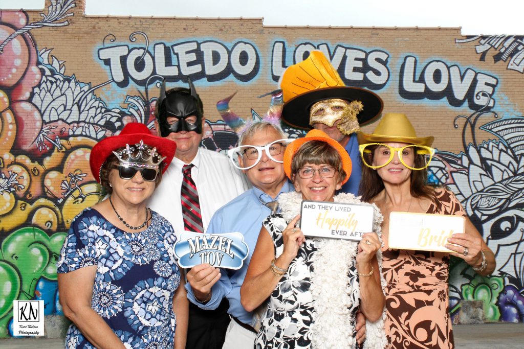 personalized wedding photo booth using toledo loves love mural as a background