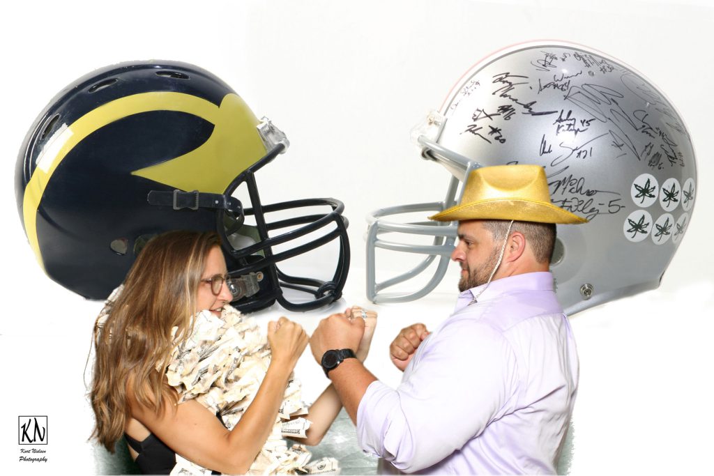 couple showing their fighting spirit when it comes to their favorite college team rivalry