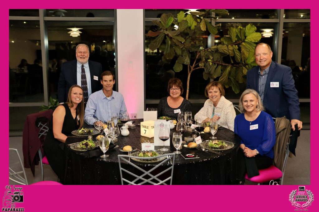 guests at a table at an event at Owens Corning