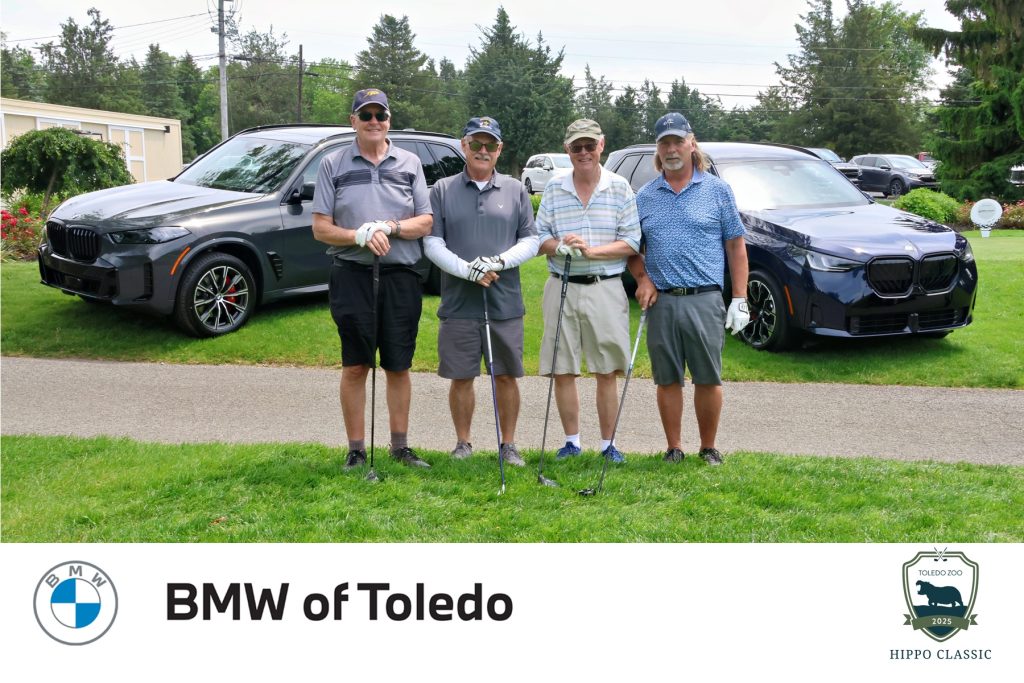 golf foursome from Comfort Line posing for a photo at The Hippo Classic benefiting the Toledo Zoo