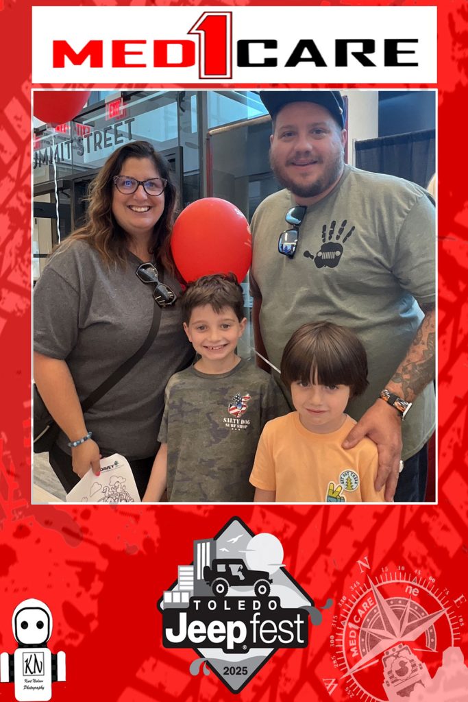 family posing for photo inside the Glass City Center at Jeep Fest
