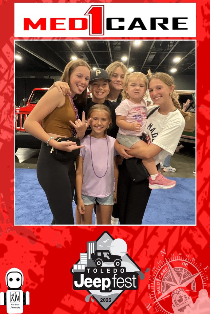 family posing for photo from Rosie the robot photo booth inside the Glass City Event Center Jeep History Exhibit