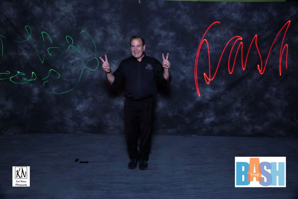 Kurt Nielsen posing in the light painting photo booth at the Imagination station's biggest fundraiser, The Bash.