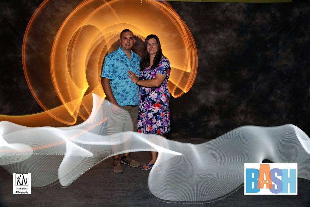 couple posing in my light painting photo booth at the Imagination Station Bash by Kurt Nielsen Photography