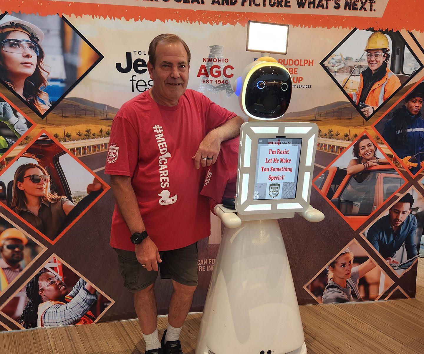 Kurt Nielsen and Rosie the Robot AI photo booth posing for a photo at Toledo Jeep Fest inside the Glass City Center