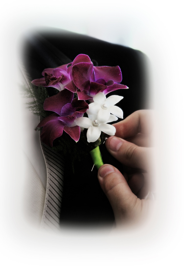 purple and white boutonnieres