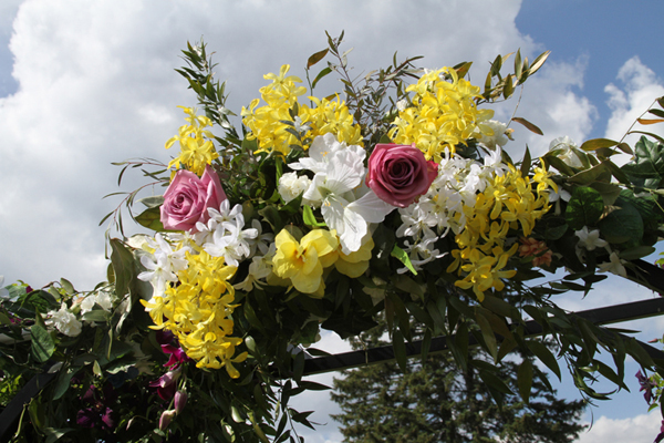 flowers decorating wedding arch
