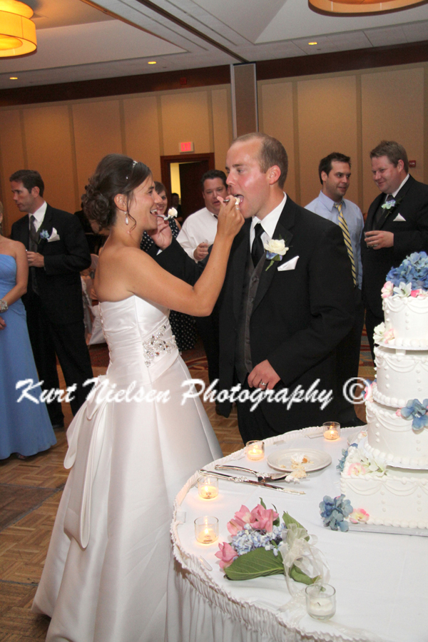 feeding each other wedding cake