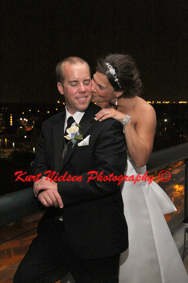 wedding photos on the balcony of the Grand Plaza Hotel