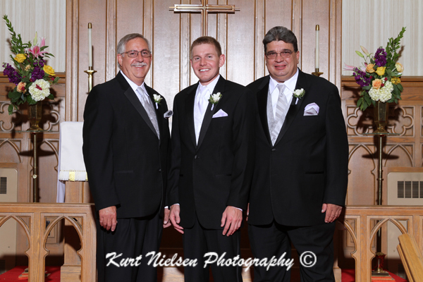 groom with the fathers photos