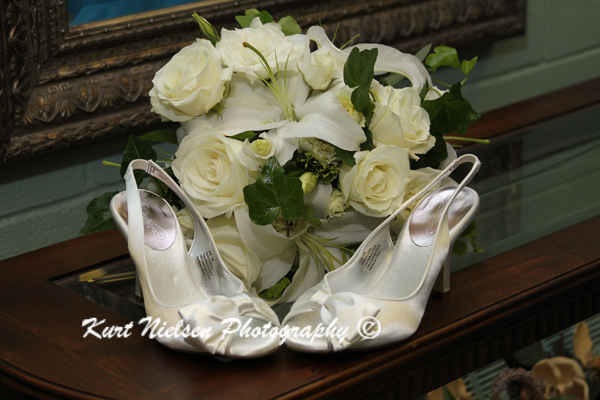 white roses wedding bouquet and shoes