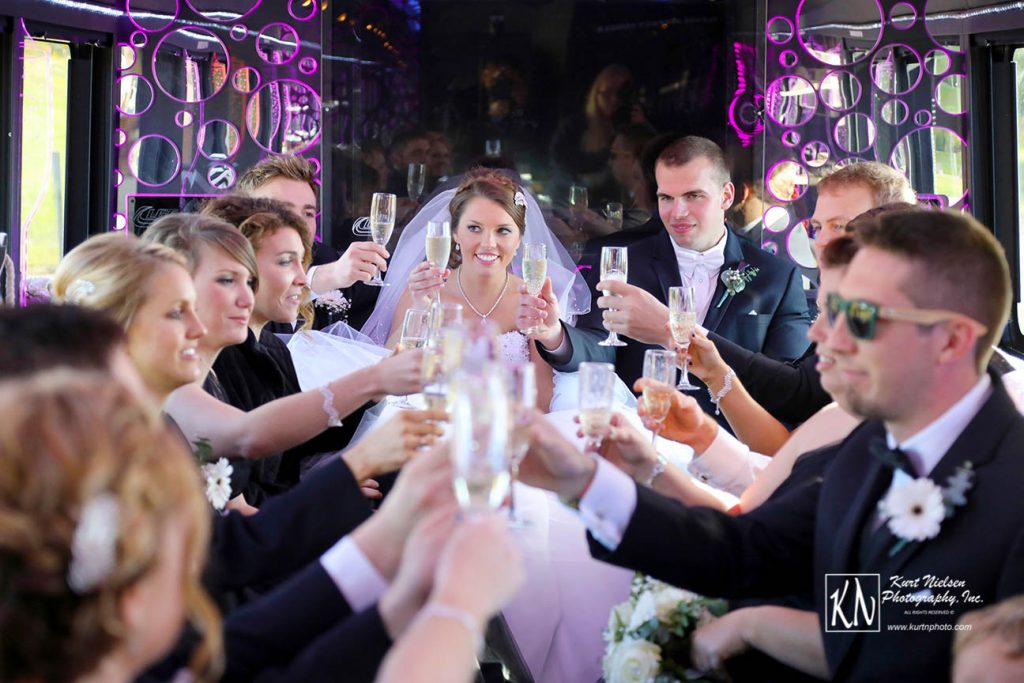 champagne toast in back of limo as captured by Kurt Nielsen Photography