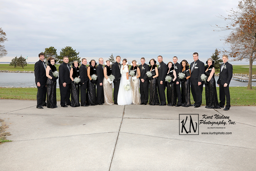 winter wedding party photo on the beach of lake erie