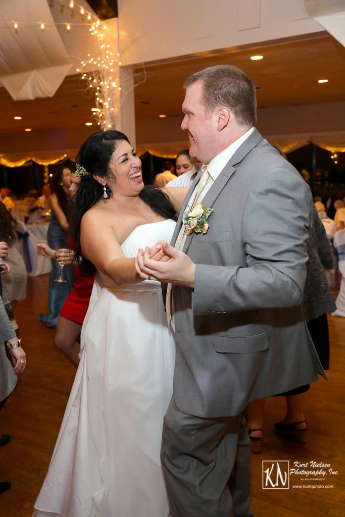 happy bride and groom dancing the night away