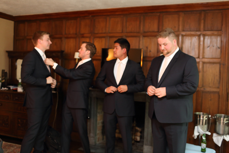 the groom and groomsmen getting ready before the wedding at the Club at Hillbrook in Chagrin Falls Ohio