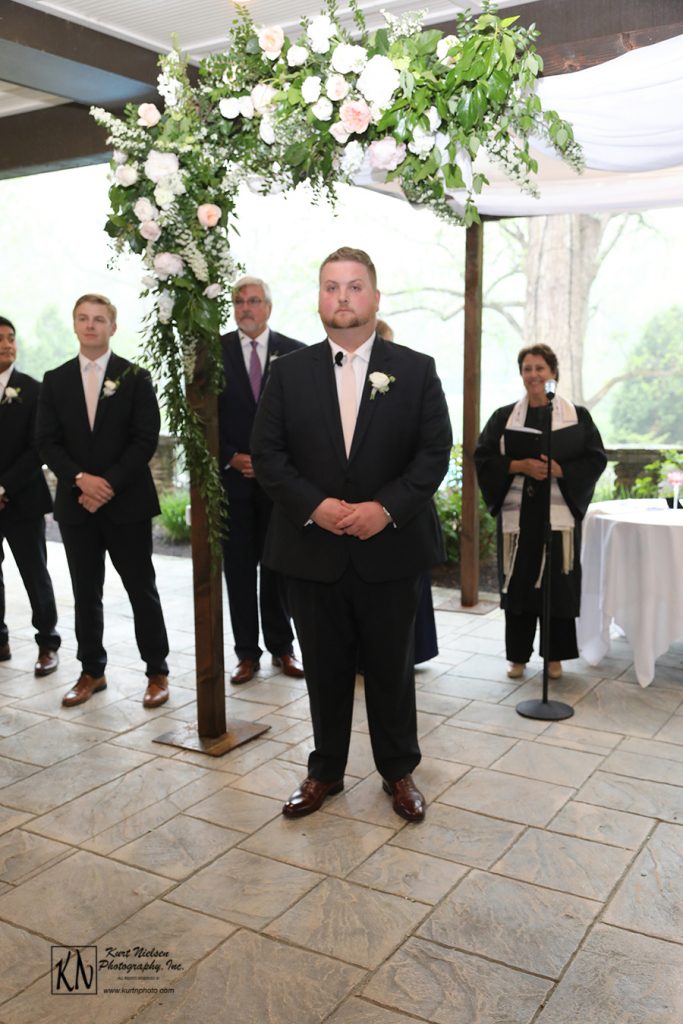 groom anticipating the bride's arrival