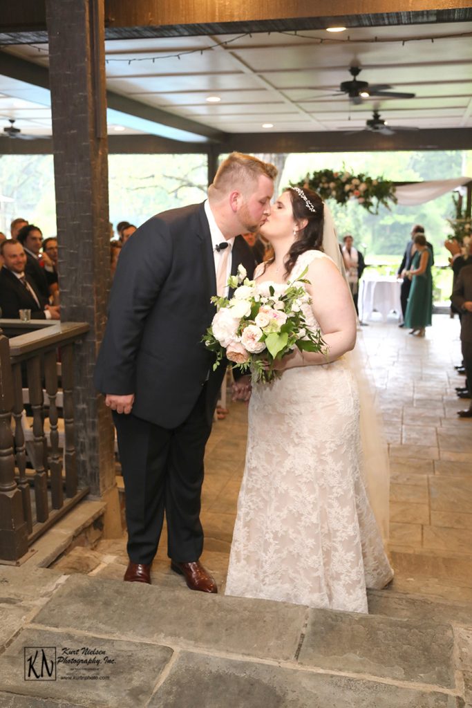 stopping for a kiss after the marriage ceremony