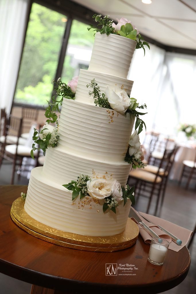 flowers from Molly Taylor and Co and gold leaf flakes on wedding cake from Luna Bakery and Cafe 