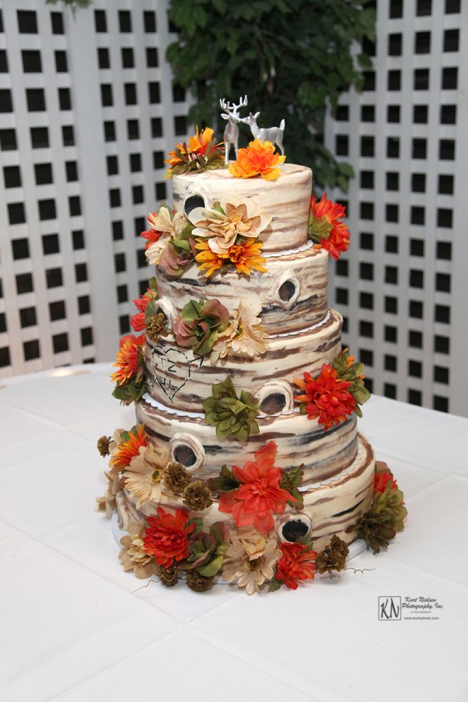 wood log themed five tier wedding cake with deer cake topper