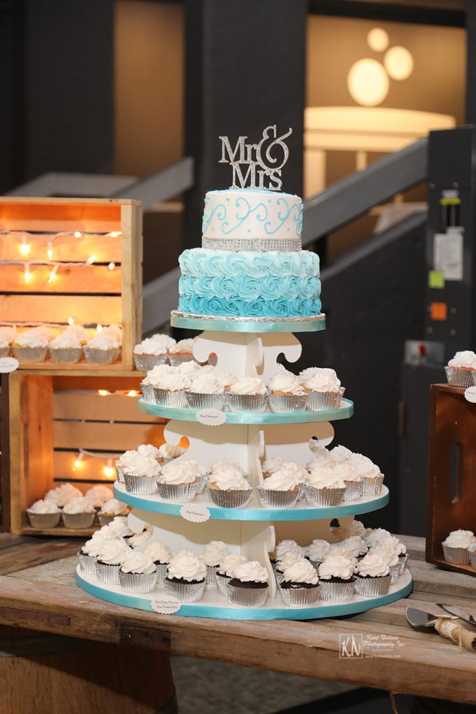 blue ombre rosettes wedding cake and cupcakes