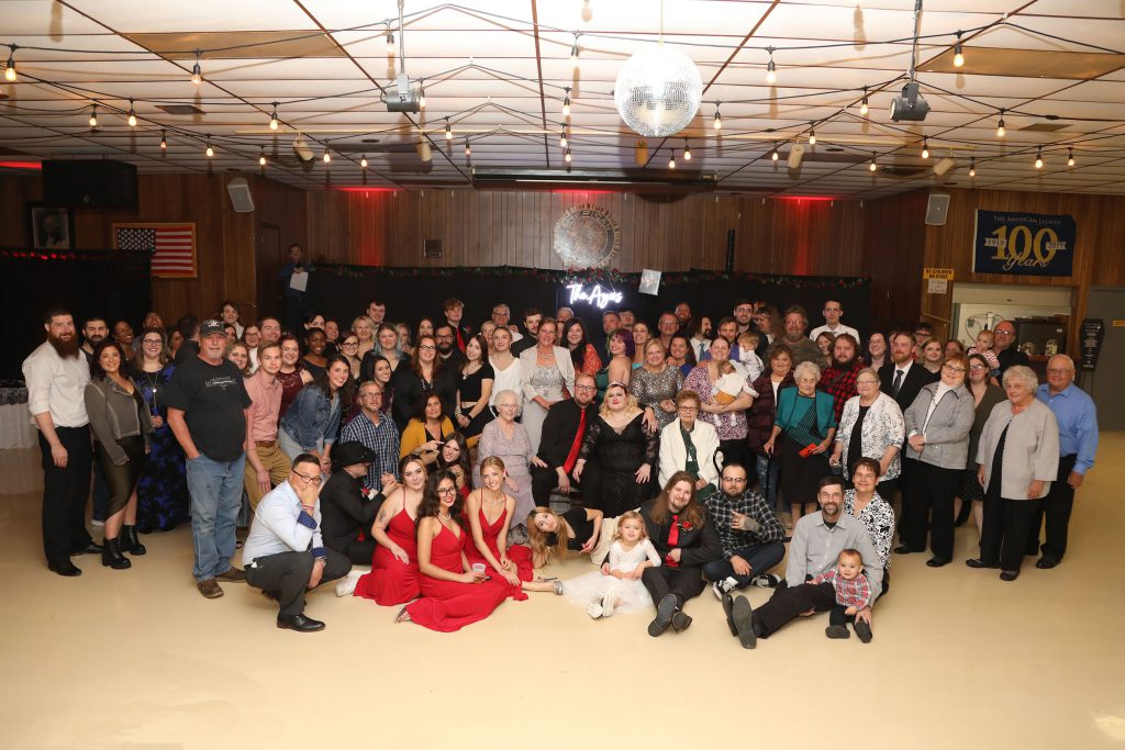 photo of all of the guests attending the wedding reception 